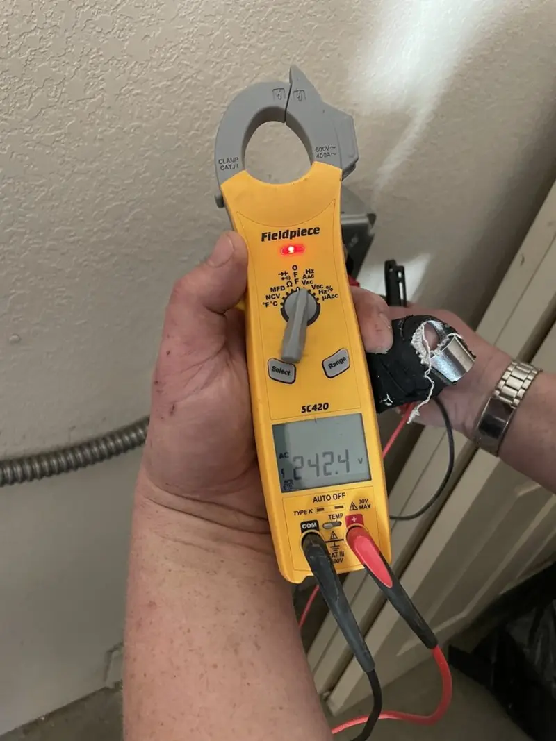 Voltage testing with clamp meter during Electrical Installation Services in Nocatee